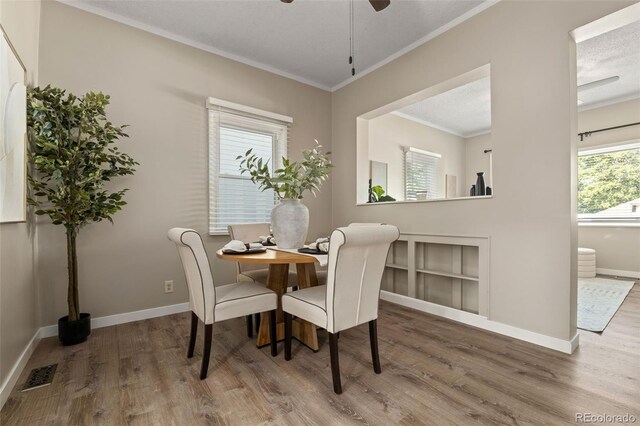 3024 S Sherman St, Englewood, CO 80113 - dining area featuring wood finished floors, ornamental molding, baseboards, and a ceiling fan
