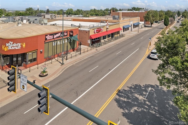 3024 S Sherman St, Englewood, CO 80113 - view of asphalt street featuring curbs, sidewalks, street lighting, and traffic lights