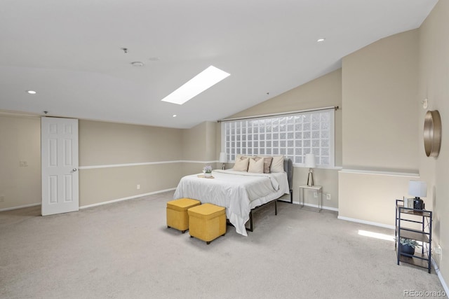 bedroom with vaulted ceiling with skylight, recessed lighting, carpet flooring, and baseboards