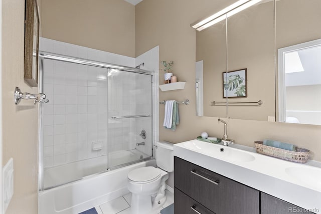 bathroom featuring shower / bath combination with glass door, vanity, toilet, and tile patterned floors