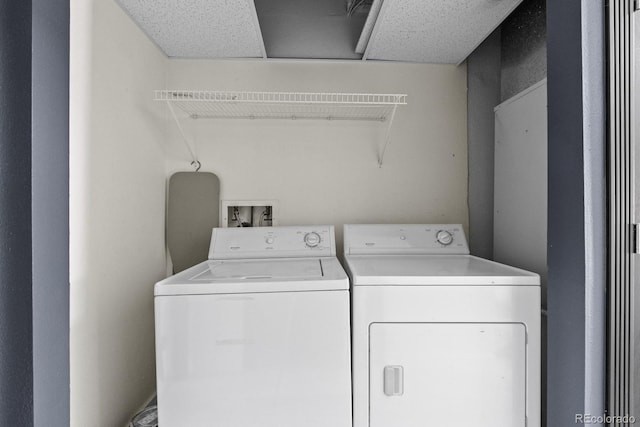 laundry area with laundry area and washer and clothes dryer