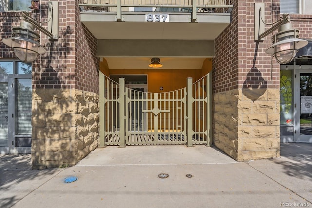 property entrance featuring brick siding