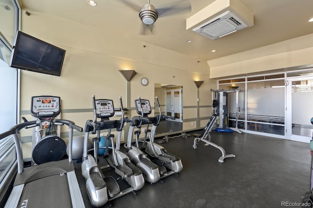 workout area featuring recessed lighting and baseboards