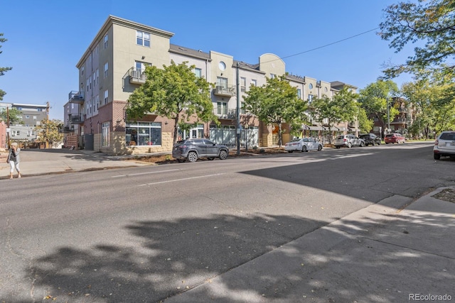 view of street with sidewalks and curbs