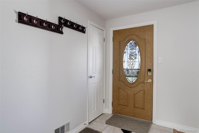 6280 Quay St, Arvada, CO 80003 - doorway with light tile patterned floors and baseboards