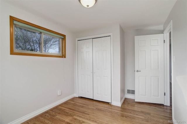 6280 Quay St, Arvada, CO 80003 - unfurnished bedroom featuring wood finished floors, baseboards, and a closet