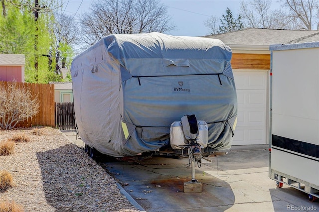 6280 Quay St, Arvada, CO 80003 - view of outdoor structure featuring fence and a garage