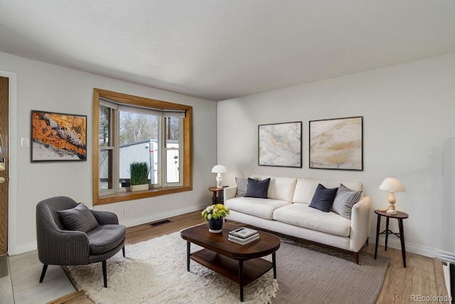 6280 Quay St, Arvada, CO 80003 - living room featuring baseboards and wood finished floors