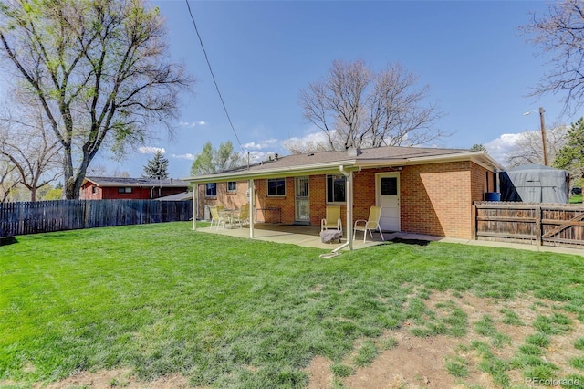6280 Quay St, Arvada, CO 80003 - back of property featuring a patio and brick siding