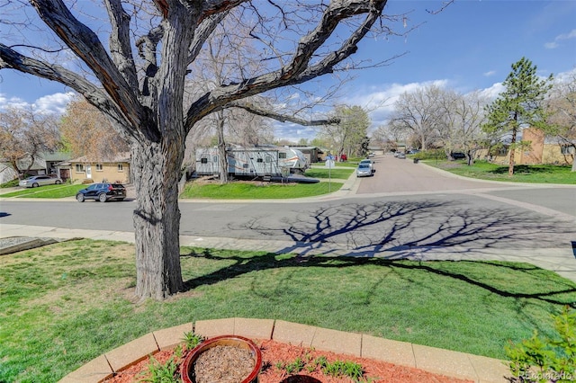6280 Quay St, Arvada, CO 80003 - view of asphalt road with a residential view, sidewalks, and curbs