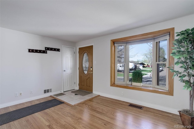 6280 Quay St, Arvada, CO 80003 - entryway featuring wood finished floors and baseboards