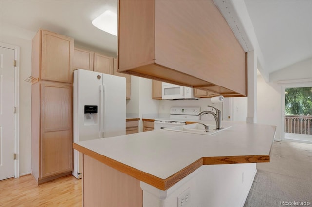 1972 S Carr St, Lakewood, CO 80227 - kitchen with light brown cabinets, white appliances, a sink, a peninsula, and light countertops