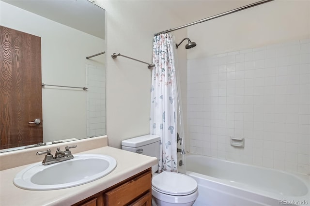 full bath featuring vanity, toilet, and shower / bath combo