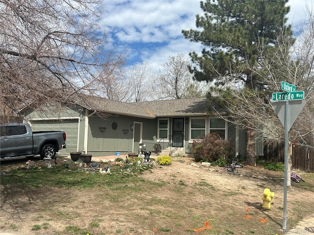 ranch-style home with a garage