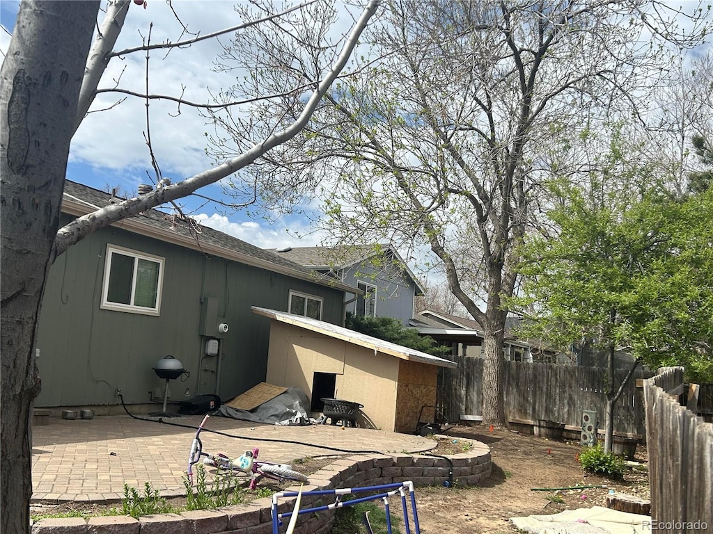 back of property with a patio