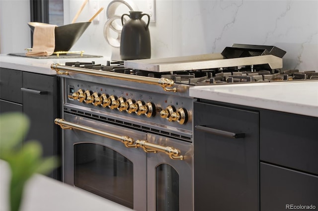 3709 Tejon St, Denver, CO 80211 - detailed view of high end stove and gray cabinetry