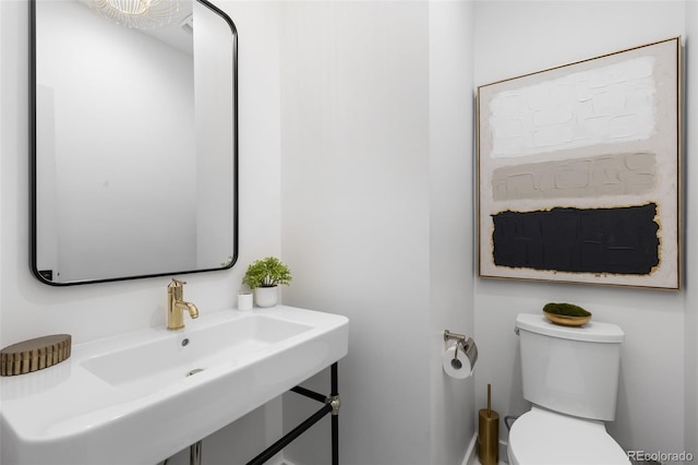 3709 Tejon St, Denver, CO 80211 - half bathroom featuring toilet and a sink
