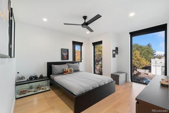 3709 Tejon St, Denver, CO 80211 - bedroom with access to outside, light wood-style flooring, recessed lighting, and a ceiling fan