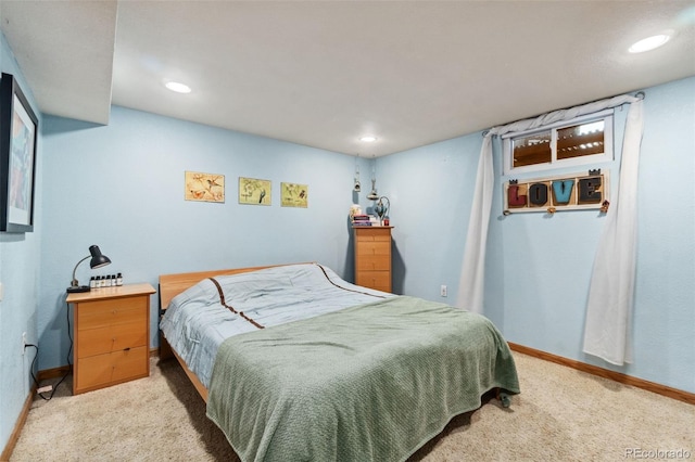 bedroom featuring light carpet