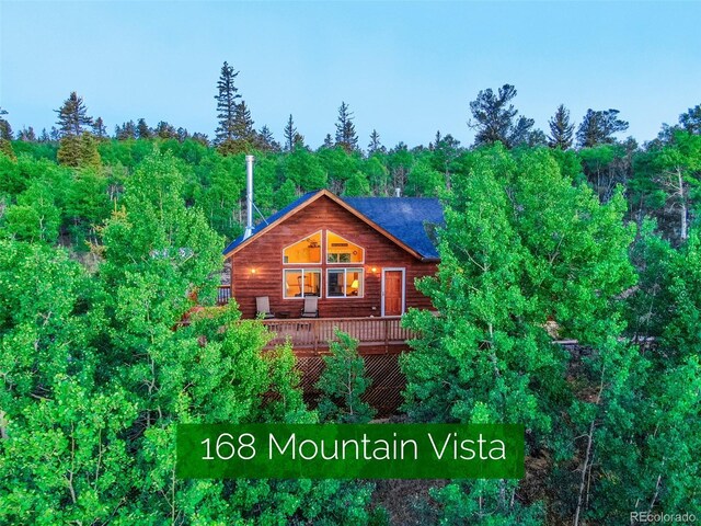 168 Mountain Vis, Como, CO 80432 - view of side of property featuring a wooden deck and a wooded view