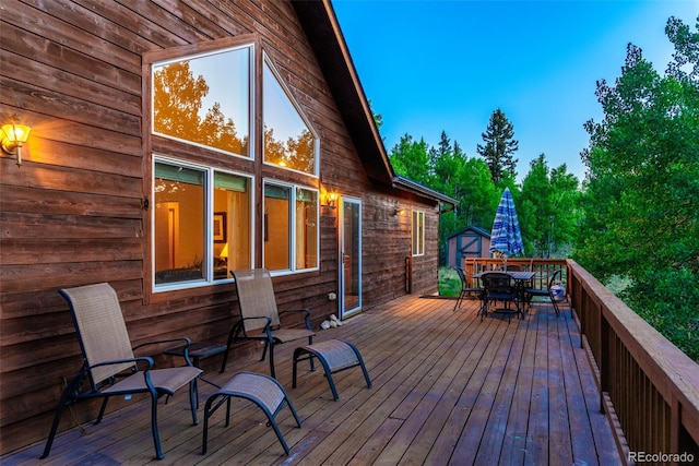168 Mountain Vis, Como, CO 80432 - deck featuring outdoor dining space and a storage unit
