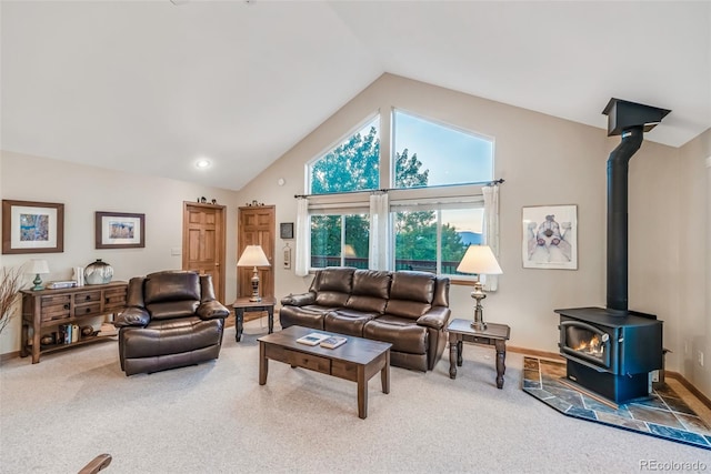 168 Mountain Vis, Como, CO 80432 - living area with carpet flooring, a wood stove, and high vaulted ceiling