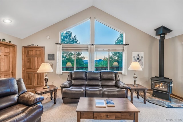 168 Mountain Vis, Como, CO 80432 - carpeted living area with lofted ceiling and a wood stove