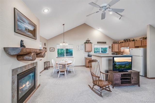 168 Mountain Vis, Como, CO 80432 - living area featuring ceiling fan, light colored carpet, lofted ceiling, a tile fireplace, and a chandelier