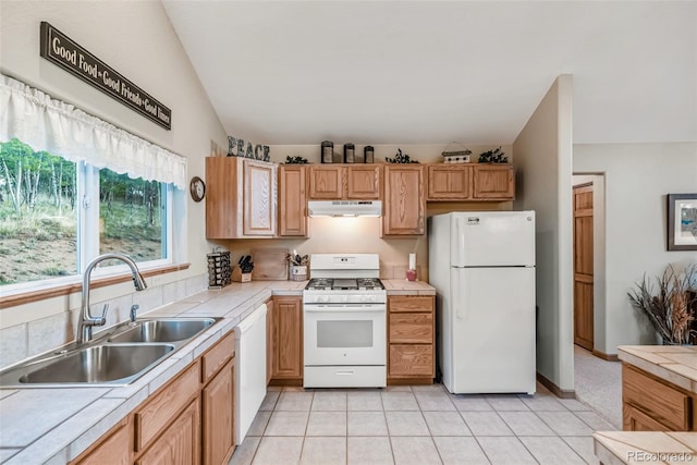168 Mountain Vis, Como, CO 80432 - kitchen featuring white appliances, tile countertops, under cabinet range hood, light tile patterned floors, and lofted ceiling