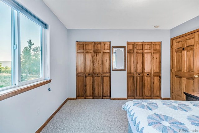 168 Mountain Vis, Como, CO 80432 - bedroom with two closets, multiple windows, and carpet floors