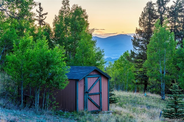 168 Mountain Vis, Como, CO 80432 - outdoor structure at dusk with a storage unit and a mountain view