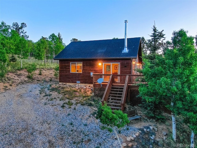 168 Mountain Vis, Como, CO 80432 - view of front of house with stairway, a wooden deck, and a shingled roof