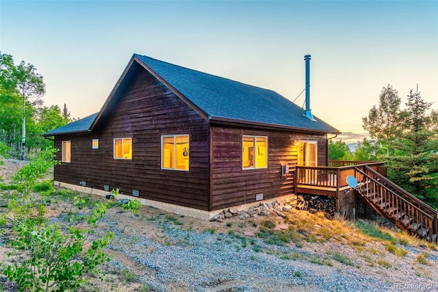 168 Mountain Vis, Como, CO 80432 - view of property exterior featuring a deck, a shingled roof, and stairway