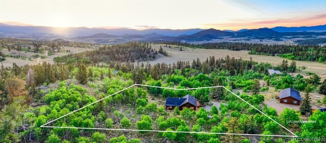 168 Mountain Vis, Como, CO 80432 - aerial view at dusk of property parcel outlined and a mountain view