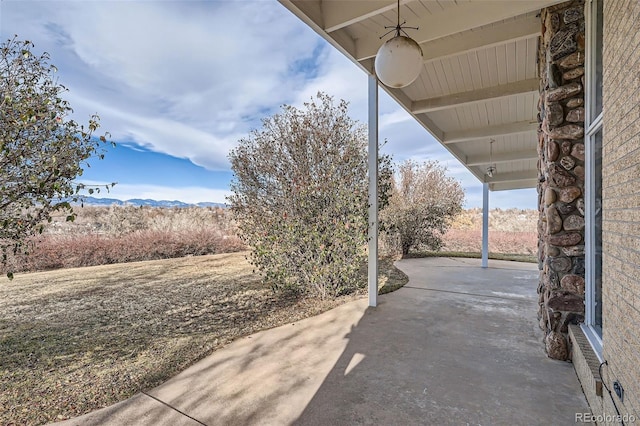 view of patio / terrace with a mountain view