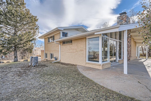 rear view of property with a patio