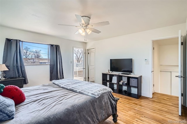 bedroom featuring ceiling fan and light hardwood / wood-style flooring