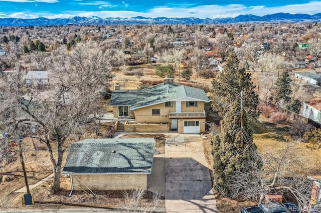 birds eye view of property with a mountain view