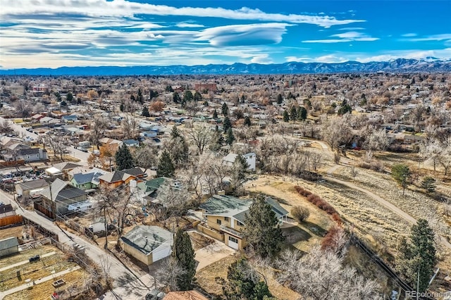 birds eye view of property with a mountain view