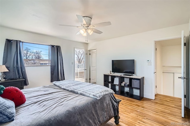 34 S Raleigh St, Denver, CO 80219 - bedroom featuring light wood finished floors, a ceiling fan, and access to outside
