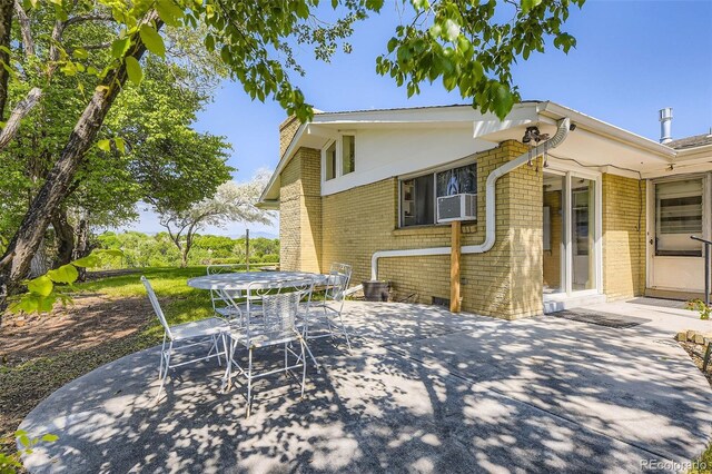 34 S Raleigh St, Denver, CO 80219 - view of patio / terrace with outdoor dining area and cooling unit