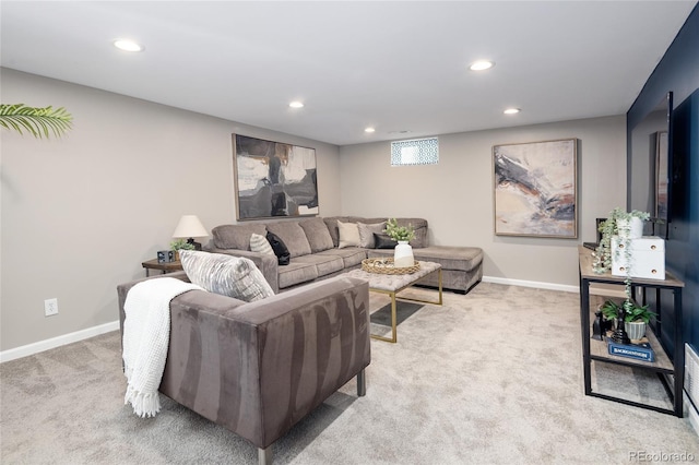 living room with light colored carpet, recessed lighting, and baseboards