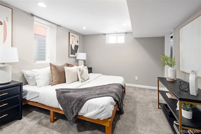 bedroom with baseboards, recessed lighting, and light carpet