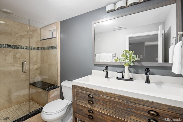 full bath with a stall shower, visible vents, toilet, and vanity