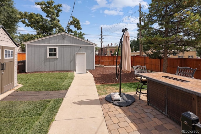 view of outdoor structure with fence, an outdoor structure, and an outdoor fire pit