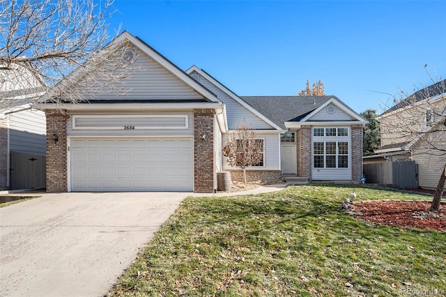 single story home featuring a garage and a front yard