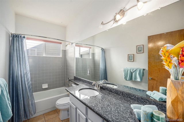 full bathroom with toilet, vanity, tile patterned floors, and shower / tub combo with curtain