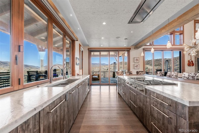 5188 Csh 125, Granby, CO 80446 - kitchen with modern cabinets, stainless steel gas cooktop, a sink, dark brown cabinets, and a textured ceiling