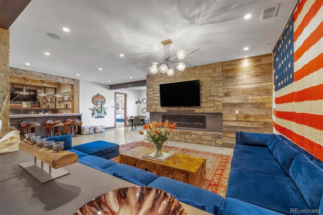 5188 Csh 125, Granby, CO 80446 - living room with recessed lighting, a stone fireplace, and wood walls