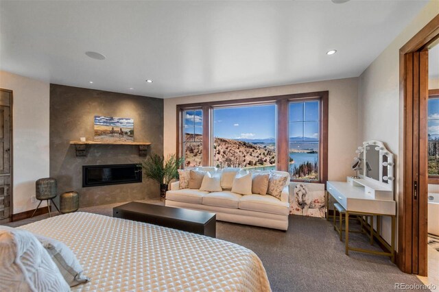 5188 Csh 125, Granby, CO 80446 - carpeted bedroom with a glass covered fireplace and recessed lighting